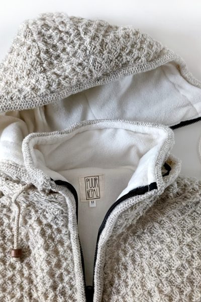 Puur Nepal vest gerstekorrel bodywarmer detail afritsbare capuchon